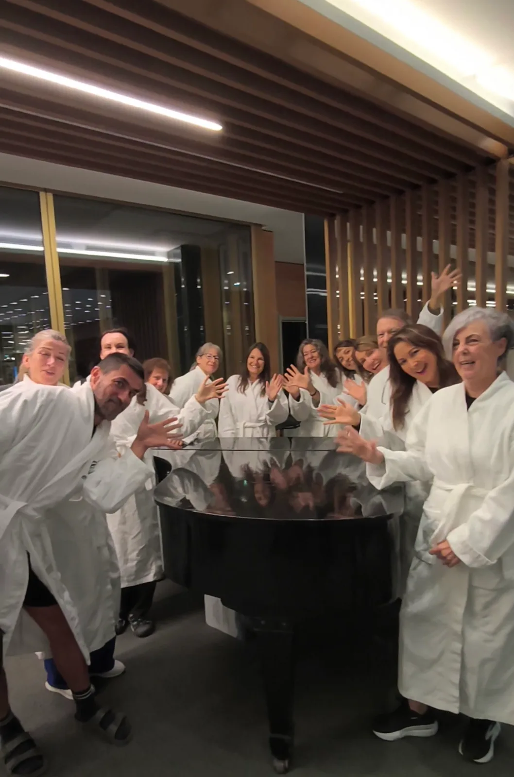 The group celebrating in the hotel's robes after an evening at the spa, Margaret Island, Budapest